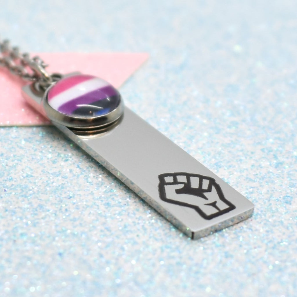 a silver necklace with a purple fist on it